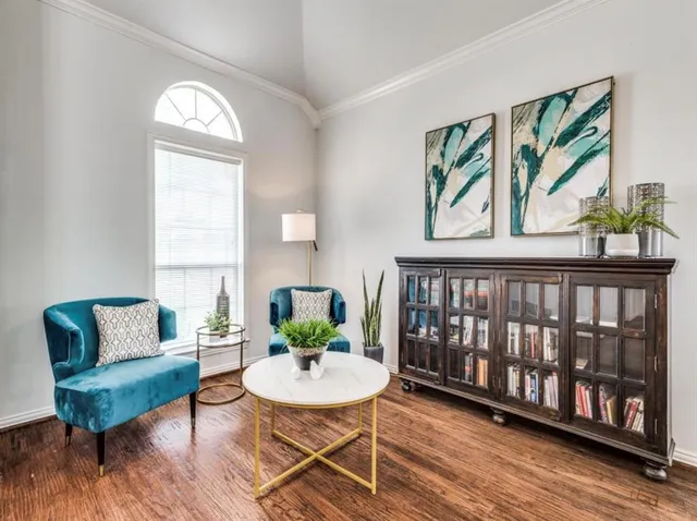 a view of a livingroom with furniture and wooden floor