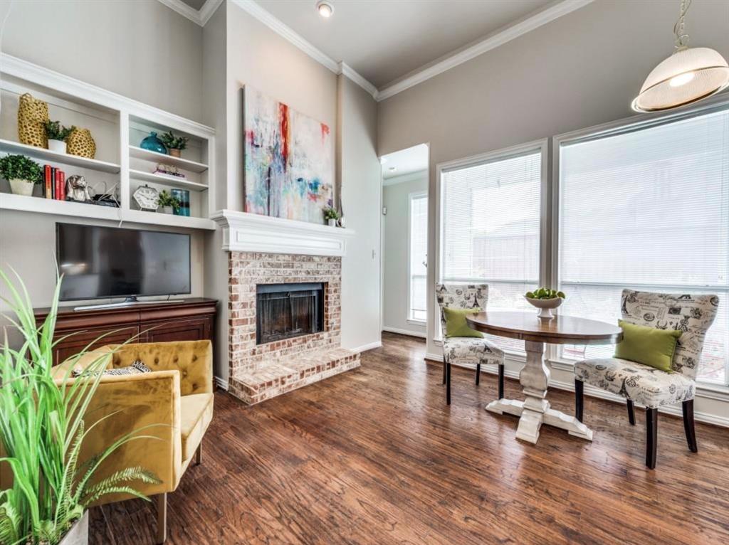 4007 Kirkmeadow Lane Dallas, TX 75287 - Photo 9 of 18 a living room with furniture and a fireplace