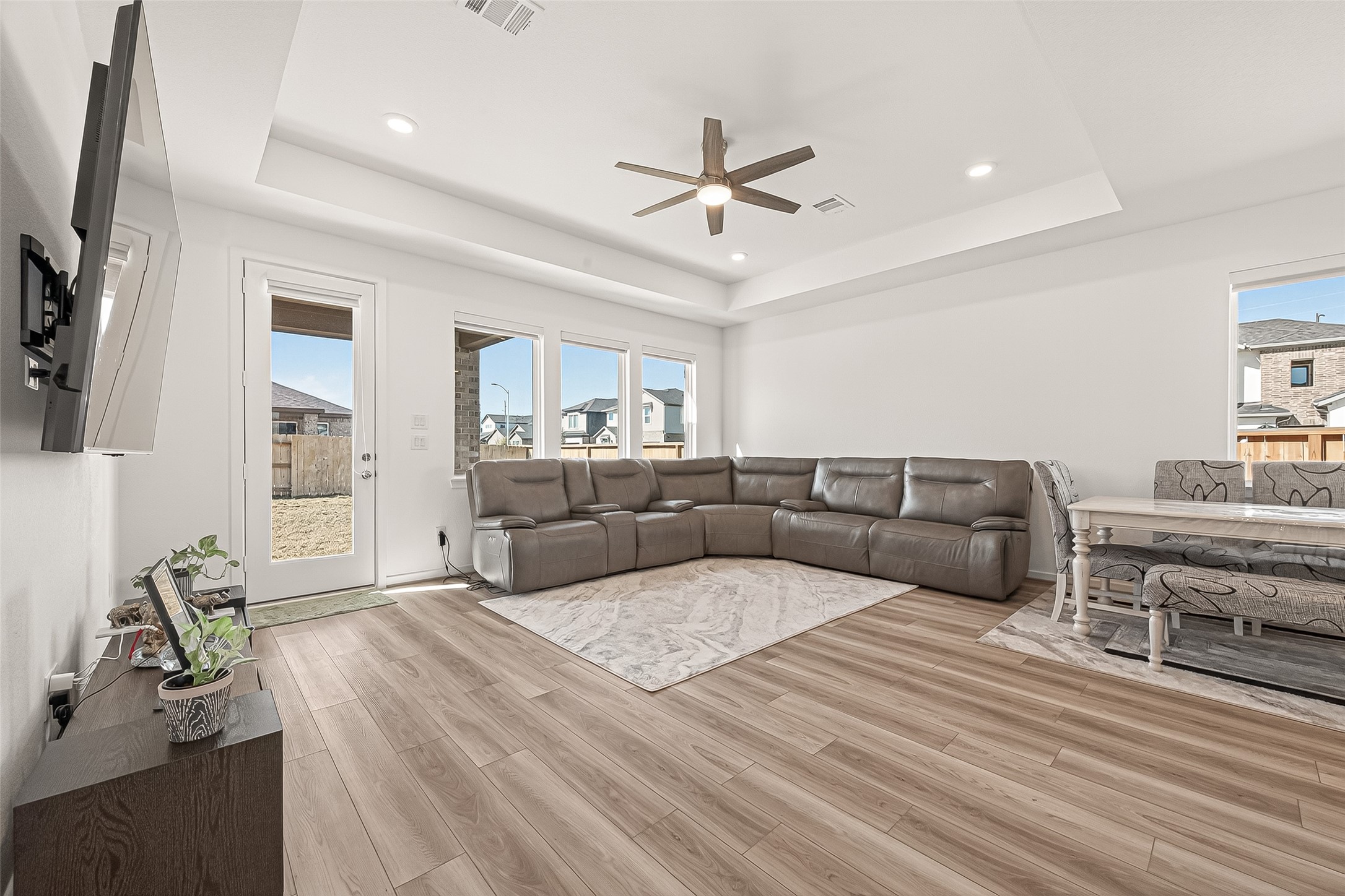 9747 Pettus Crk Drive Cypress, TX 77433 - Photo 12 of 48 a living room with furniture a ceiling fan and a rug