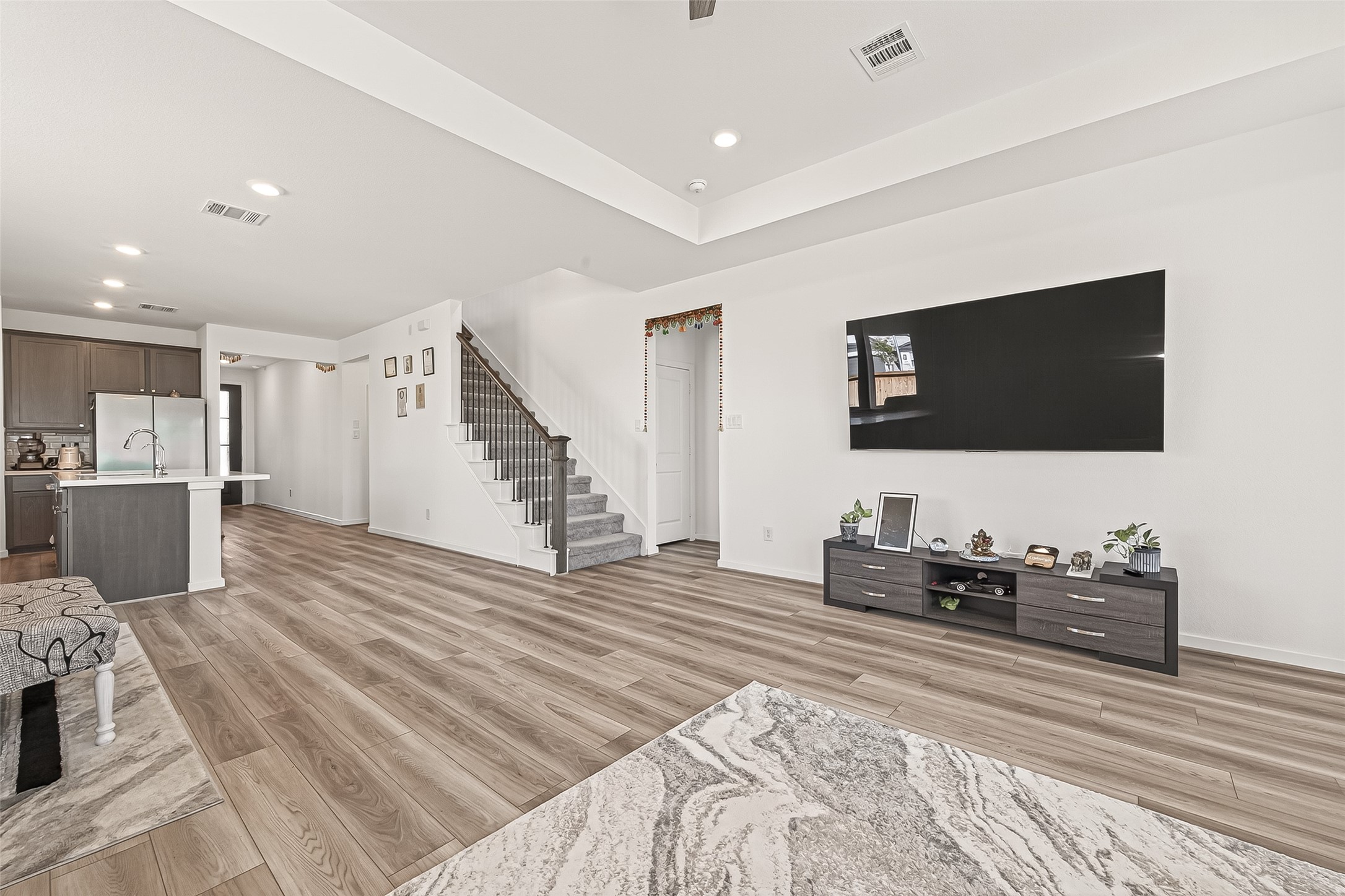 9747 Pettus Crk Drive Cypress, TX 77433 - Photo 13 of 48 a living room with furniture and a flat screen tv