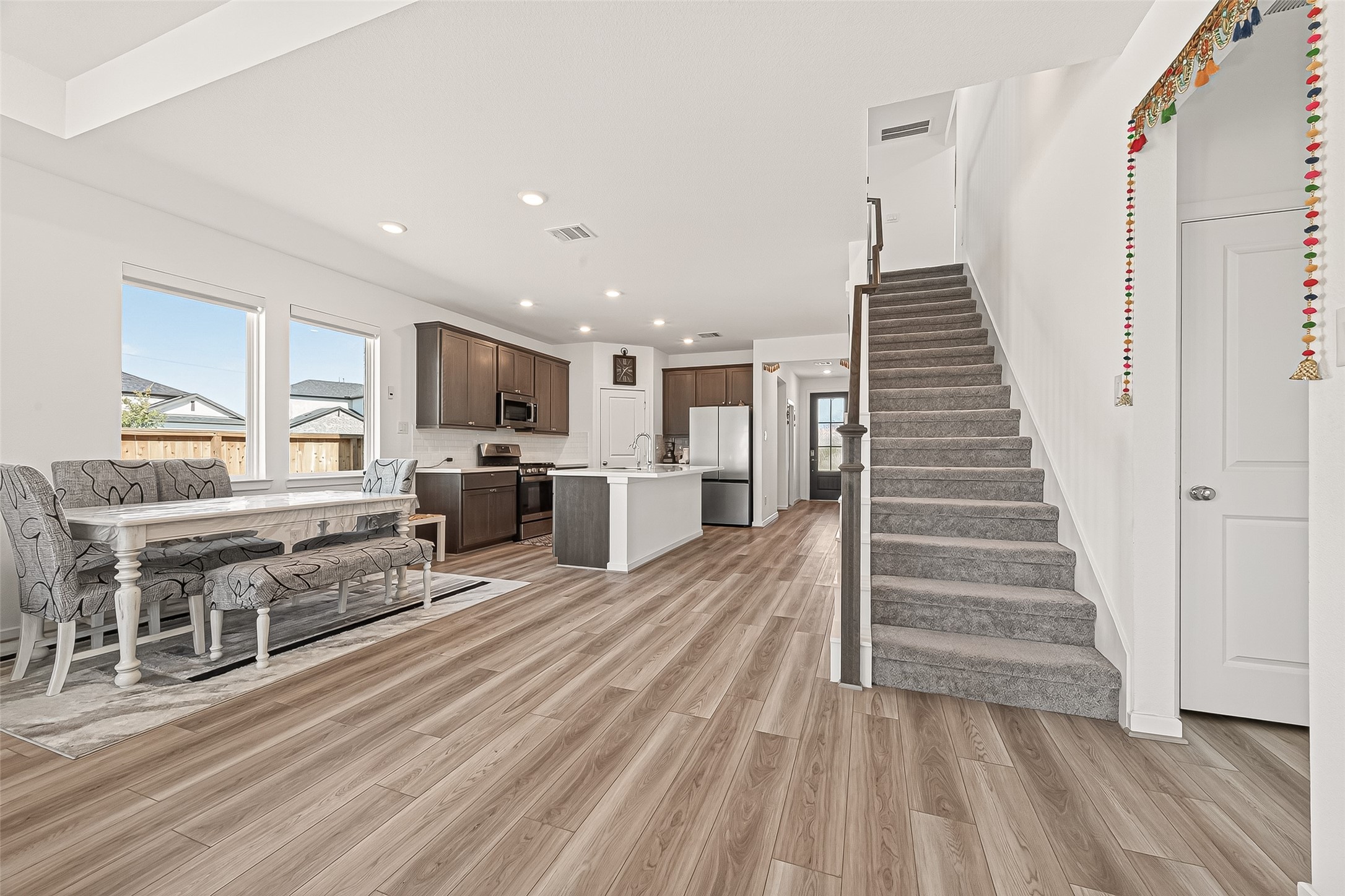9747 Pettus Crk Drive Cypress, TX 77433 - Photo 16 of 48 a view of kitchen with furniture and wooden floor
