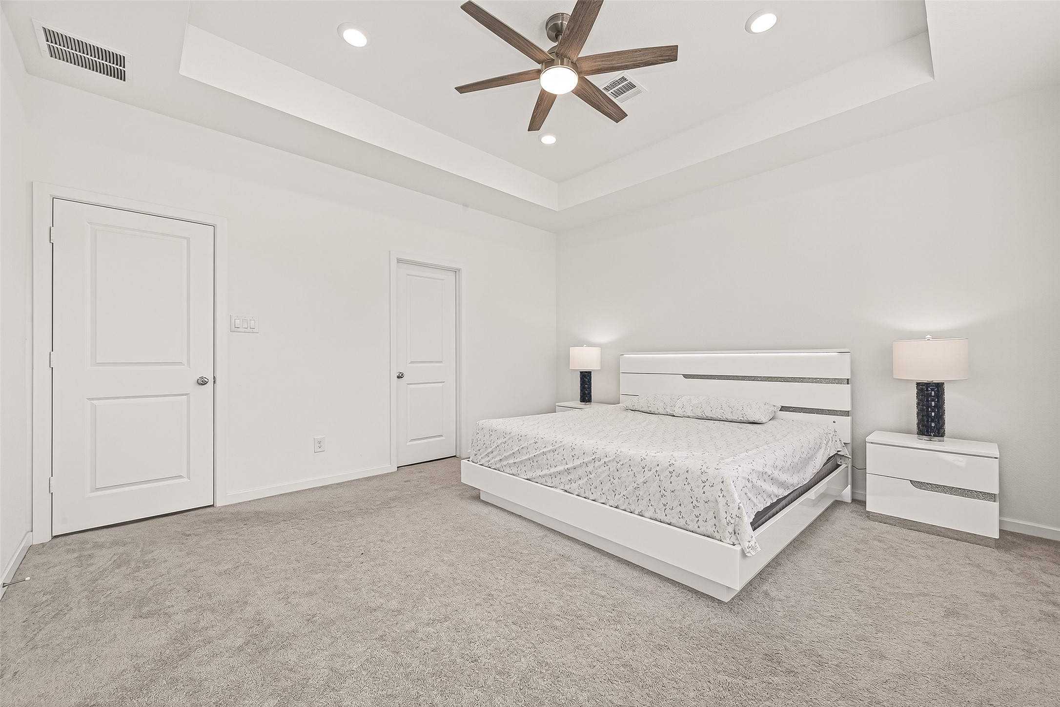 9747 Pettus Crk Drive Cypress, TX 77433 - Photo 23 of 48 a spacious bedroom with a bed and a chandelier