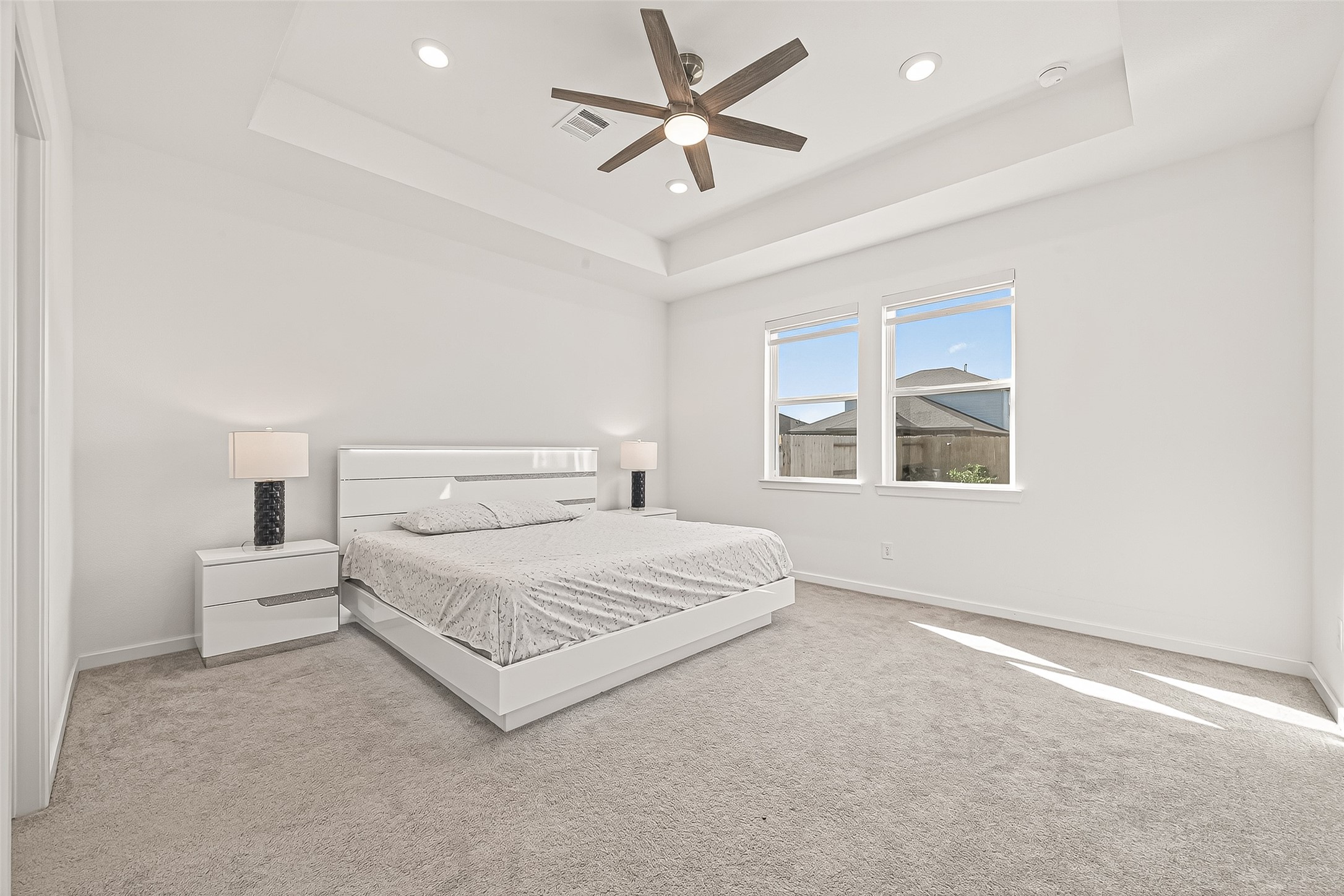 9747 Pettus Crk Drive Cypress, TX 77433 - Photo 24 of 48 a spacious bedroom with a bed and a window