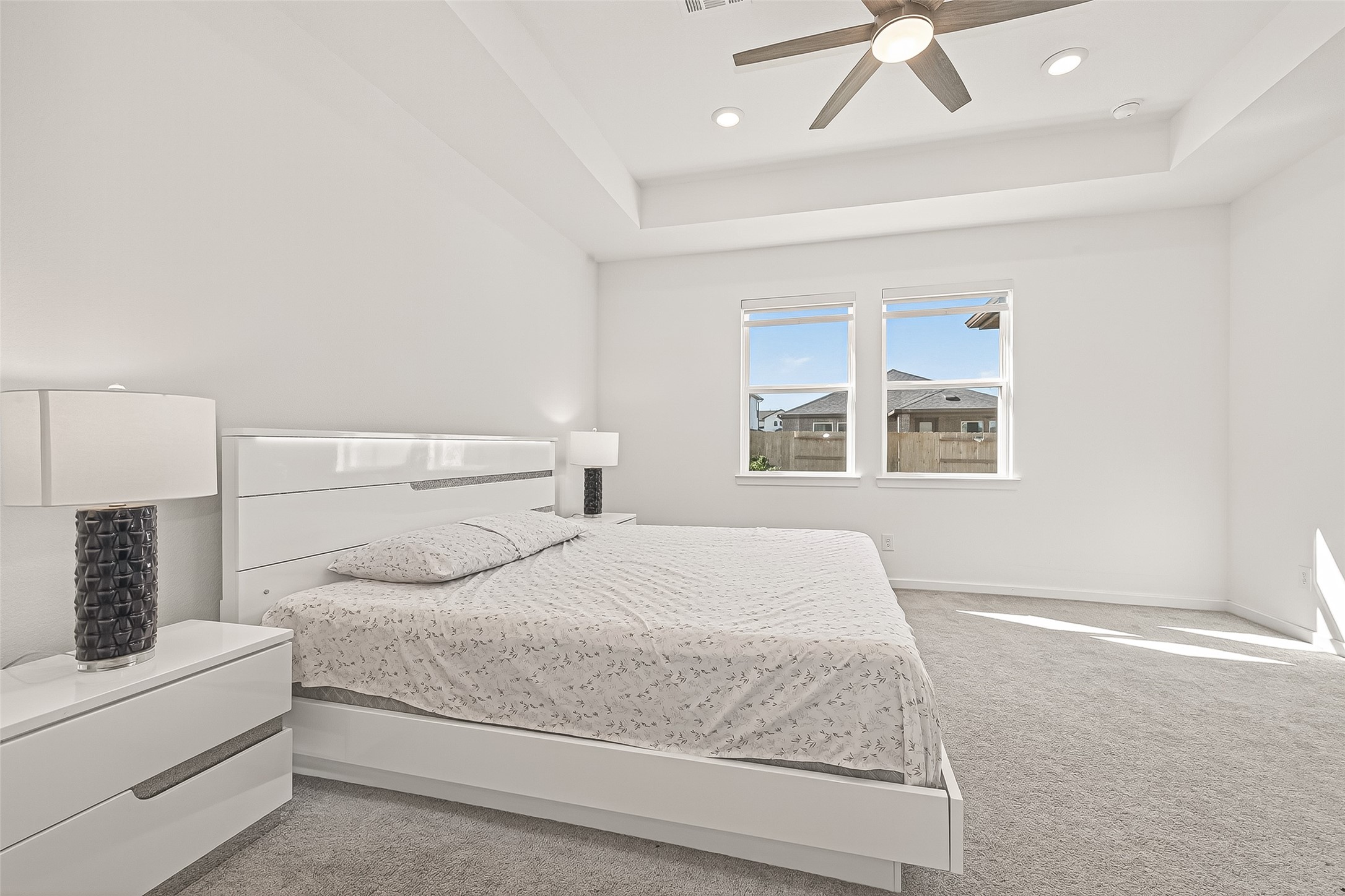 9747 Pettus Crk Drive Cypress, TX 77433 - Photo 25 of 48 a bedroom with a large bed and a window