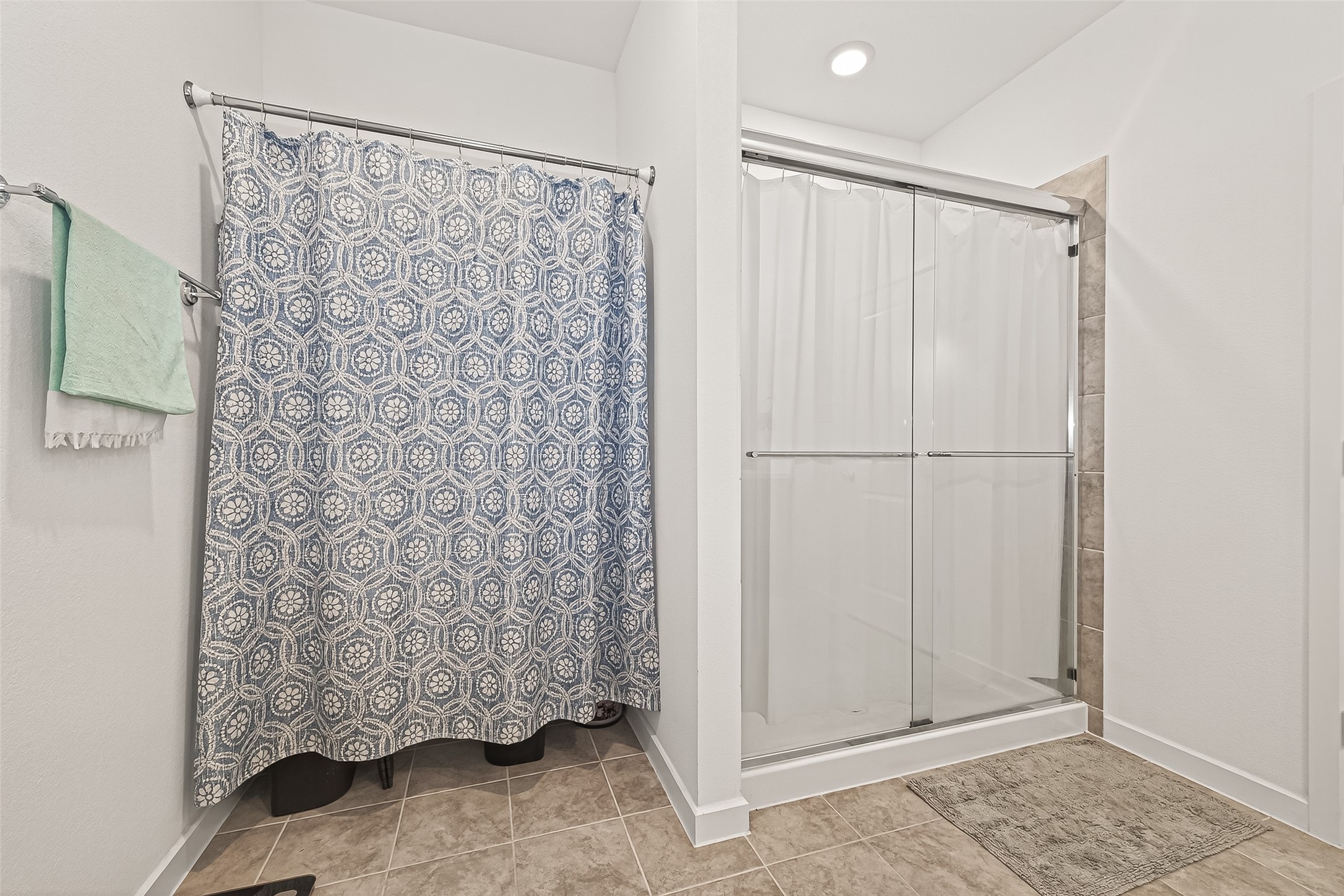 9747 Pettus Crk Drive Cypress, TX 77433 - Photo 27 of 48 a bathroom with a shower and a curtain