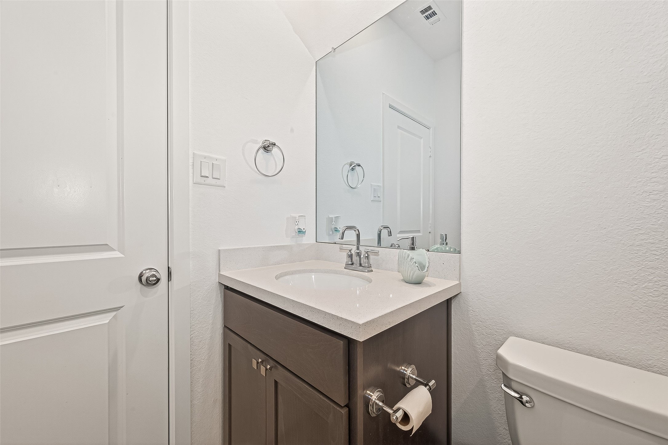 9747 Pettus Crk Drive Cypress, TX 77433 - Photo 32 of 48 a bathroom with a toilet sink and mirror