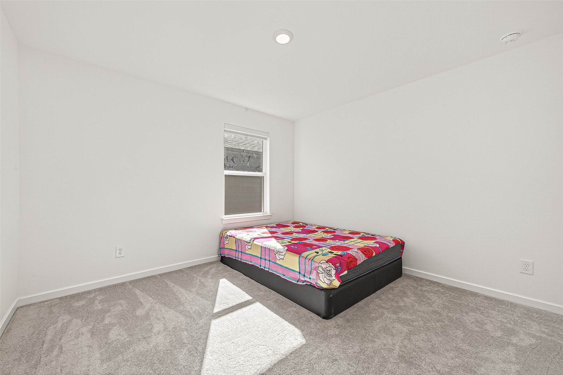 9747 Pettus Crk Drive Cypress, TX 77433 - Photo 33 of 48 a bedroom with a bed and a window