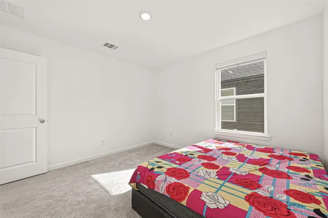 a bedroom with furniture and windows