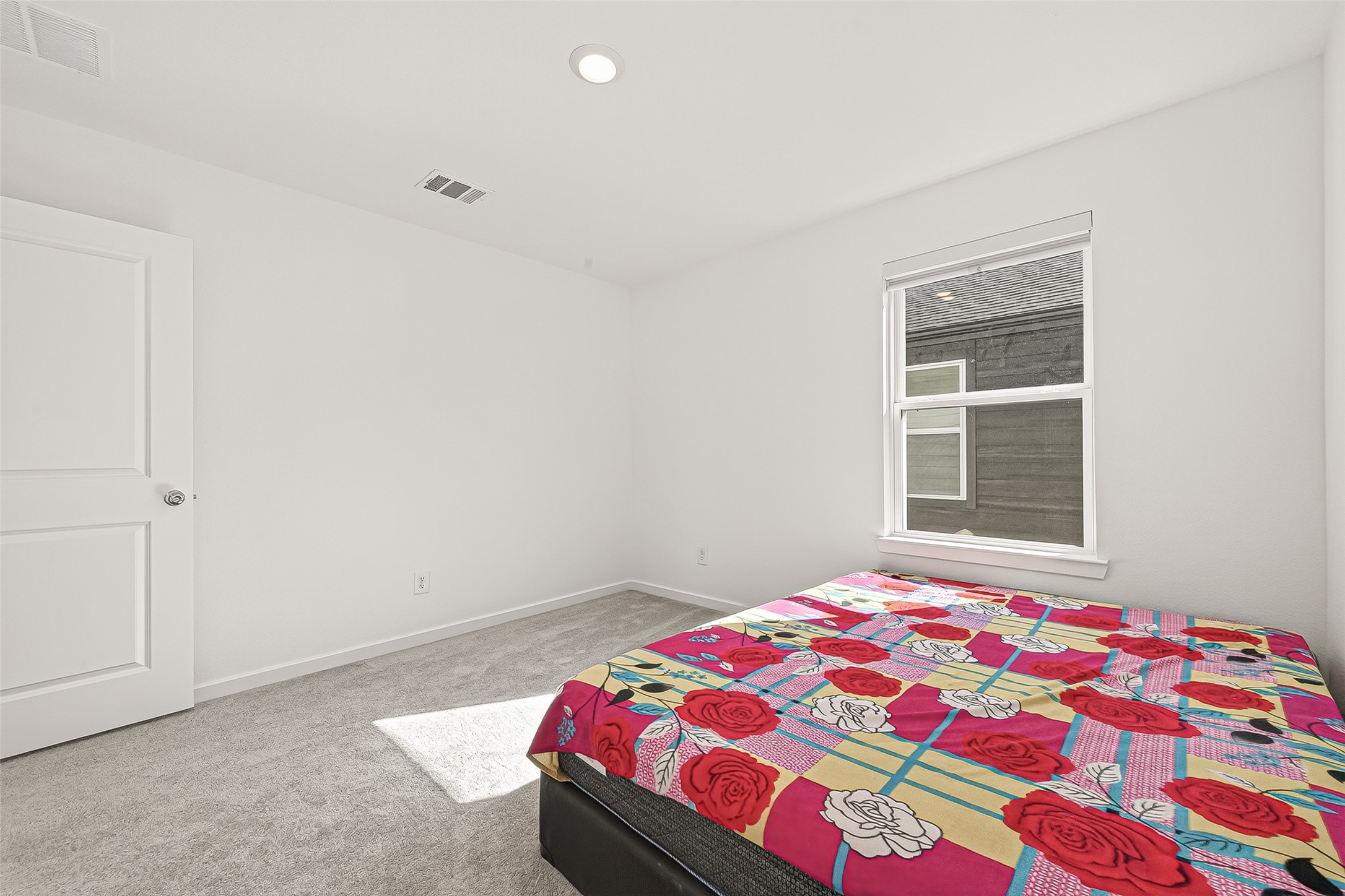 9747 Pettus Crk Drive Cypress, TX 77433 - Photo 34 of 48 a bedroom with a bed and a window