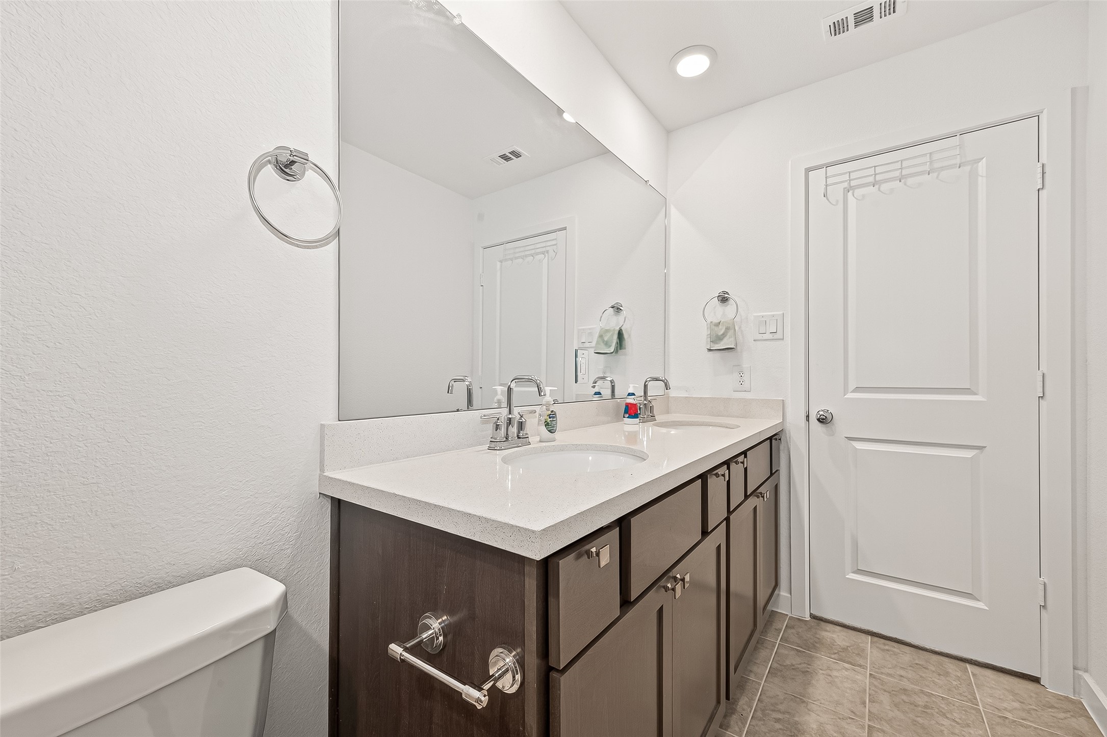9747 Pettus Crk Drive Cypress, TX 77433 - Photo 39 of 48 a bathroom with a sink toilet and vanity