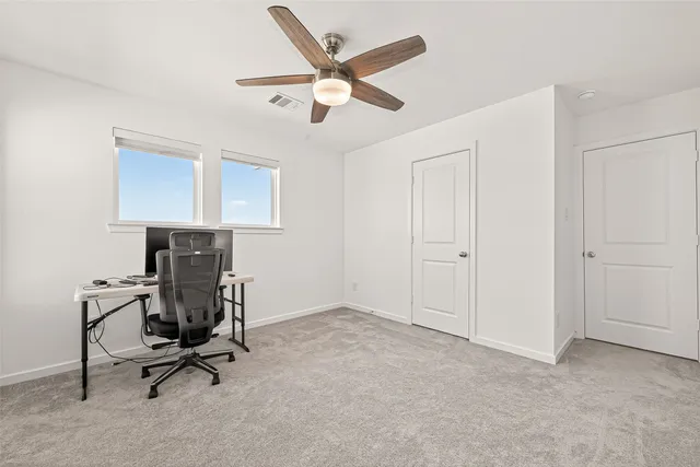 a view of workspace with lounge chair