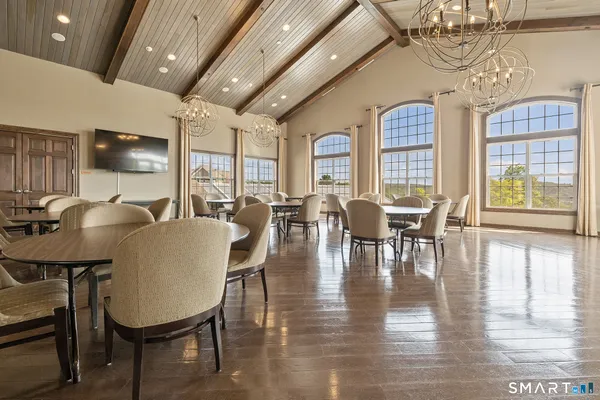 a view of a dining room with furniture window and wooden floor