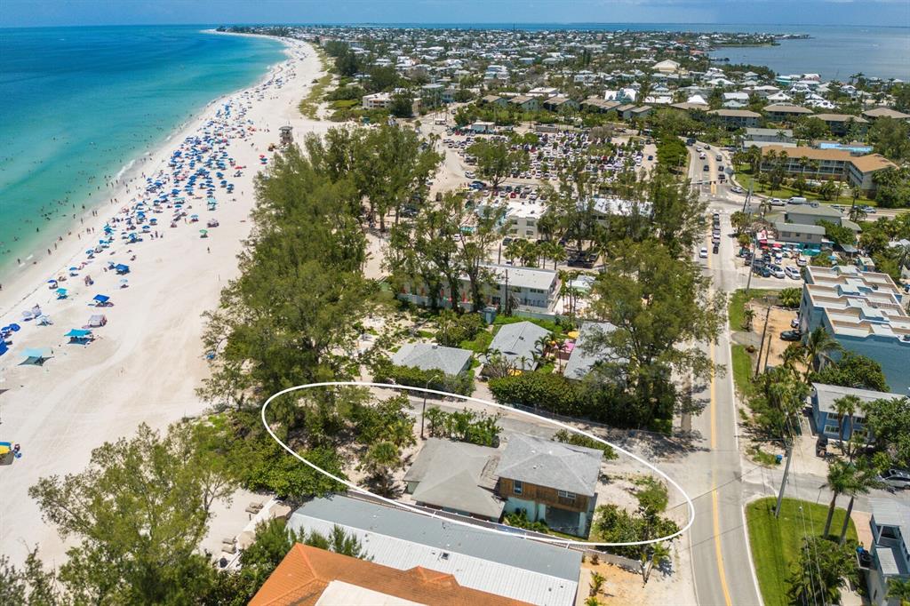 3720 Gulf Drive Holmes Beach, FL 34217 - Photo 3 of 10 an aerial view of residential houses with outdoor space