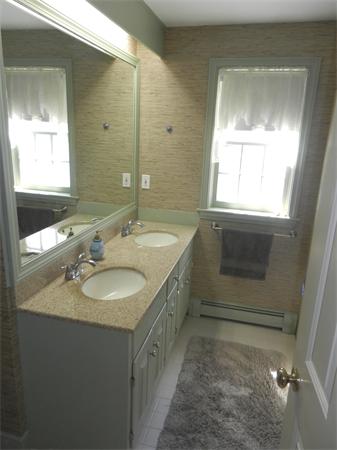 24 Herrick Road Boxford, MA 01921 - Photo 19 of 26 a bathroom with a sink and a mirror