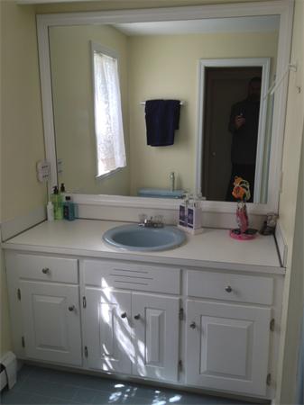24 Herrick Road Boxford, MA 01921 - Photo 21 of 26 a bathroom with a sink and a mirror