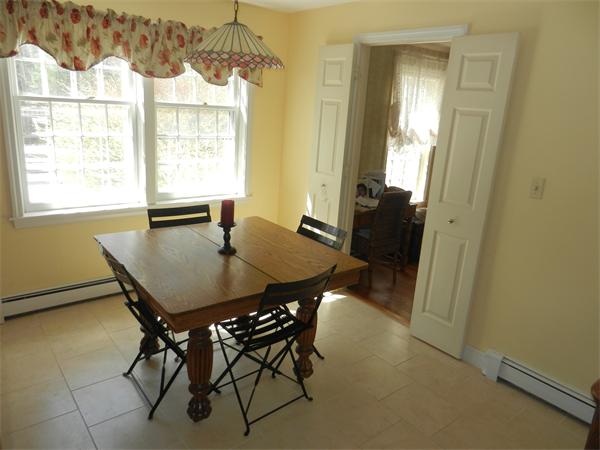 24 Herrick Road Boxford, MA 01921 - Photo 5 of 26 a view of a dining room with furniture and window