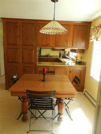 24 Herrick Road Boxford, MA 01921 - Photo 6 of 26 a room with table chairs and wooden floor