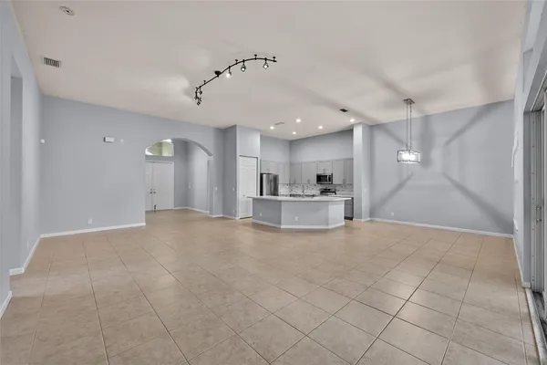 a view of a kitchen with a sink and a stove top oven