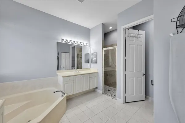 a bathroom with a bathtub and a sink