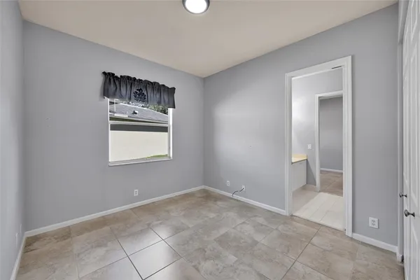 a view of kitchen and hallway with window