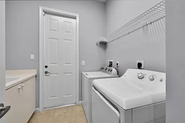 a utility room with dryer and washer