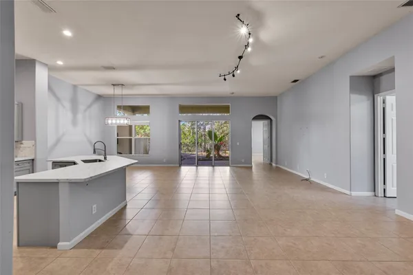 a view of a kitchen with a sink and windows