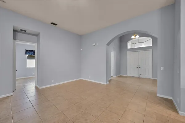 a view of an empty room and a window