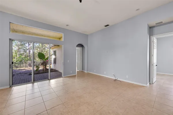 a view of an empty room with glass door
