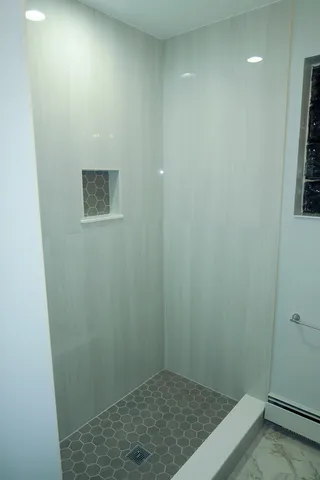 a bathroom with a granite countertop sink a mirror and vanity