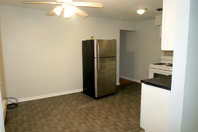 a kitchen with stainless steel appliances a refrigerator and a stove
