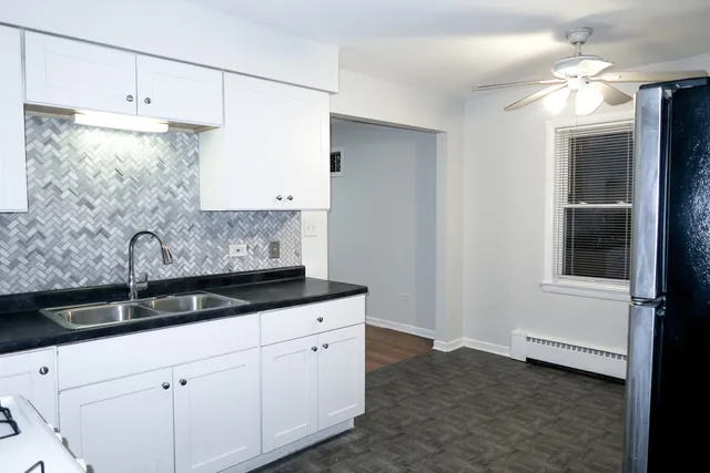 a kitchen with a sink and cabinets