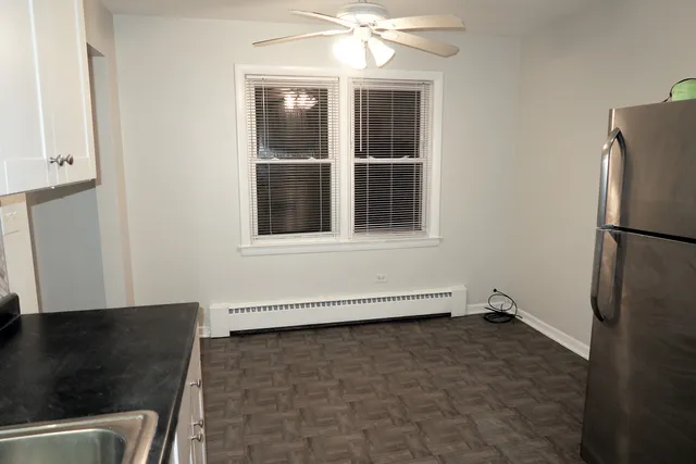 a view of a livingroom with furniture and an window