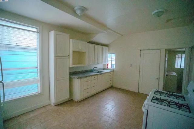 a room with window and dresser