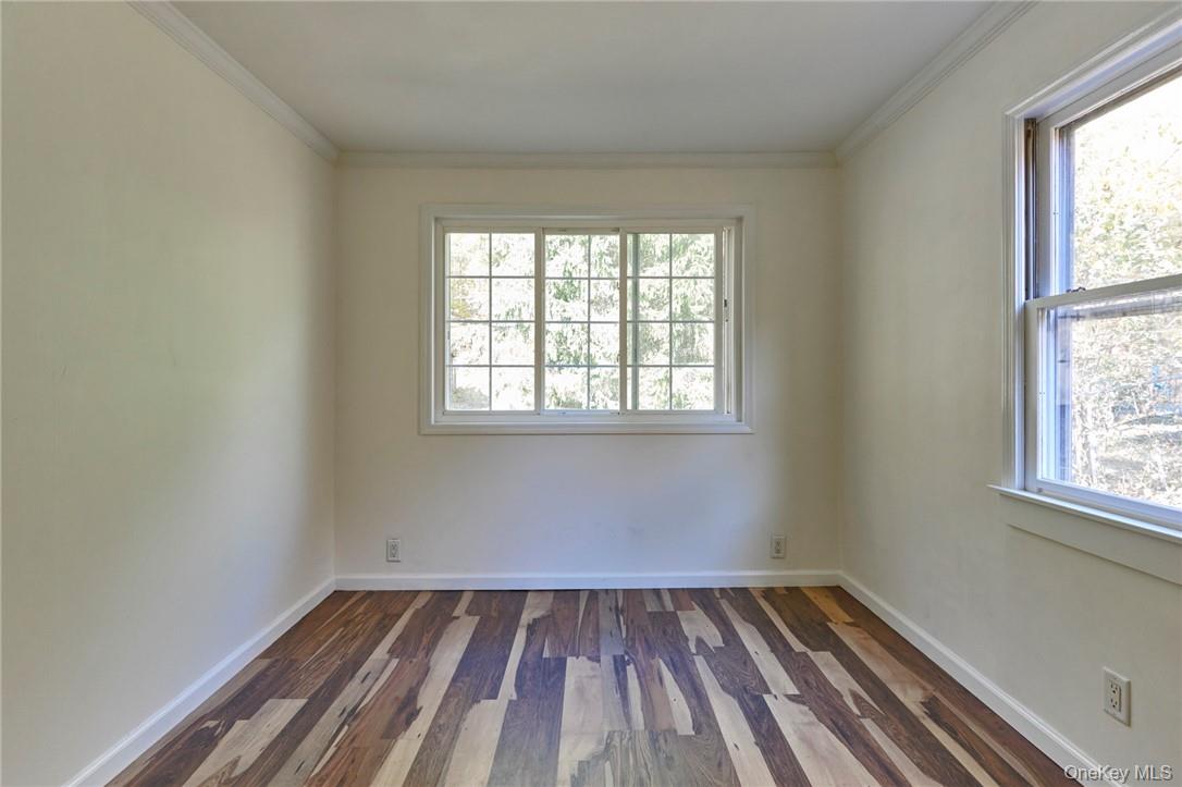 425 Spring Lake Road Red Hook, NY 12571 - Photo 14 of 23 an empty room with wooden floor and windows