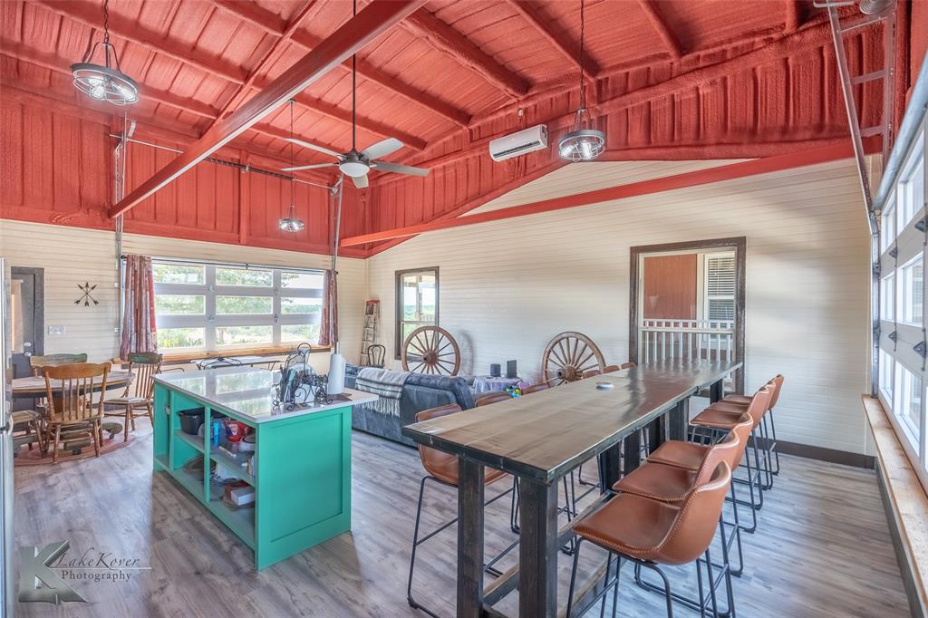 2302 County Road 360 Merkel, TX 79536 - Photo 21 of 39 a view of a dining room with furniture window and wooden floor