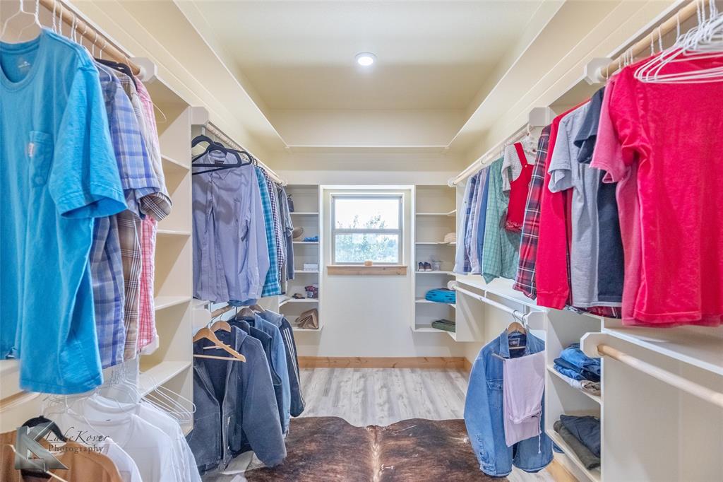 2302 County Road 360 Merkel, TX 79536 - Photo 26 of 39 a view of a bedroom with a bed and a window