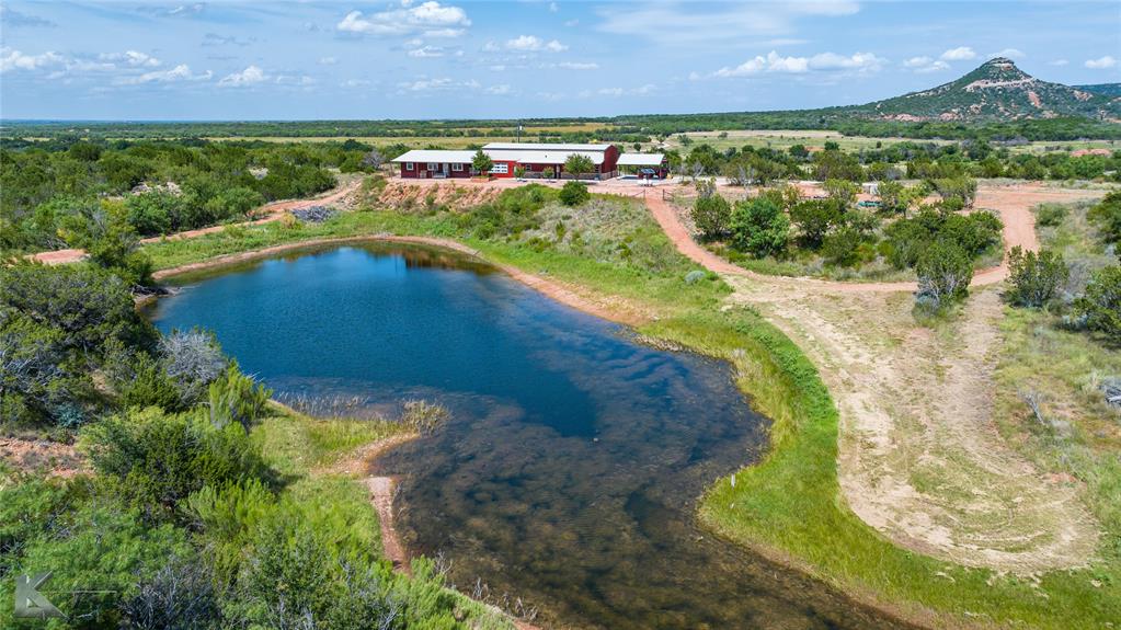2302 County Road 360 Merkel, TX 79536 - Photo 38 of 39 a view of a lake with a houses