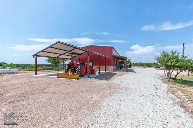 a view of a wooden deck with a yard