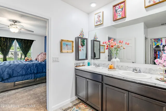 a bathroom with a sink double vanity and mirror