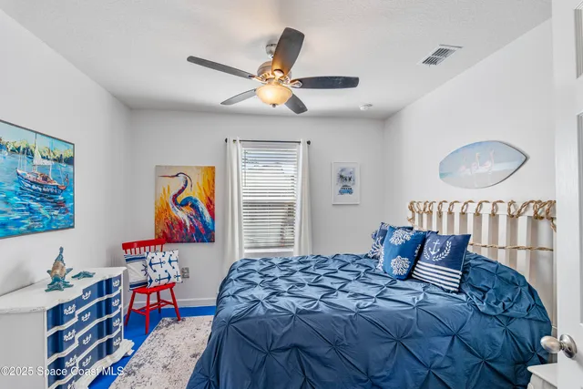 a bedroom with a bed and dresser