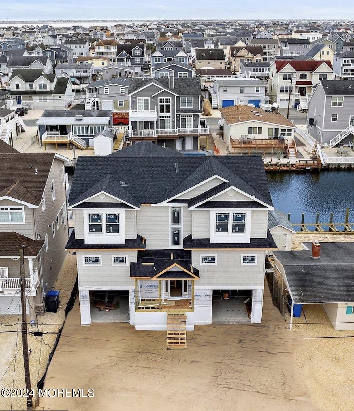 an aerial view of a house with parking spaces