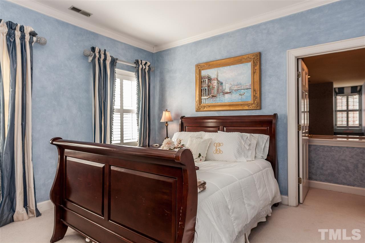 405 Lake Boone Trail Raleigh, NC 27608 - Photo 14 of 24 a bed sitting in a bedroom next to a window