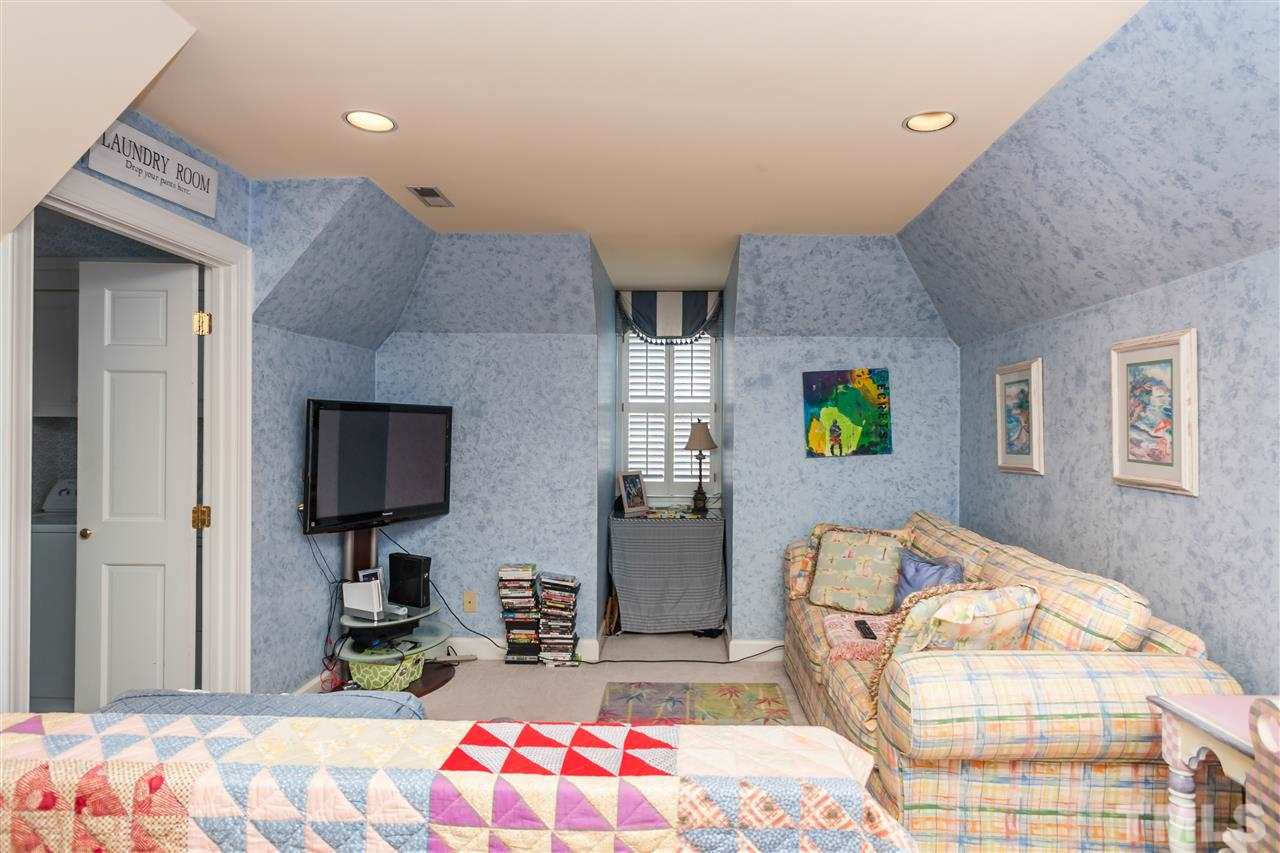 405 Lake Boone Trail Raleigh, NC 27608 - Photo 15 of 24 a bedroom with bed and wooden floor