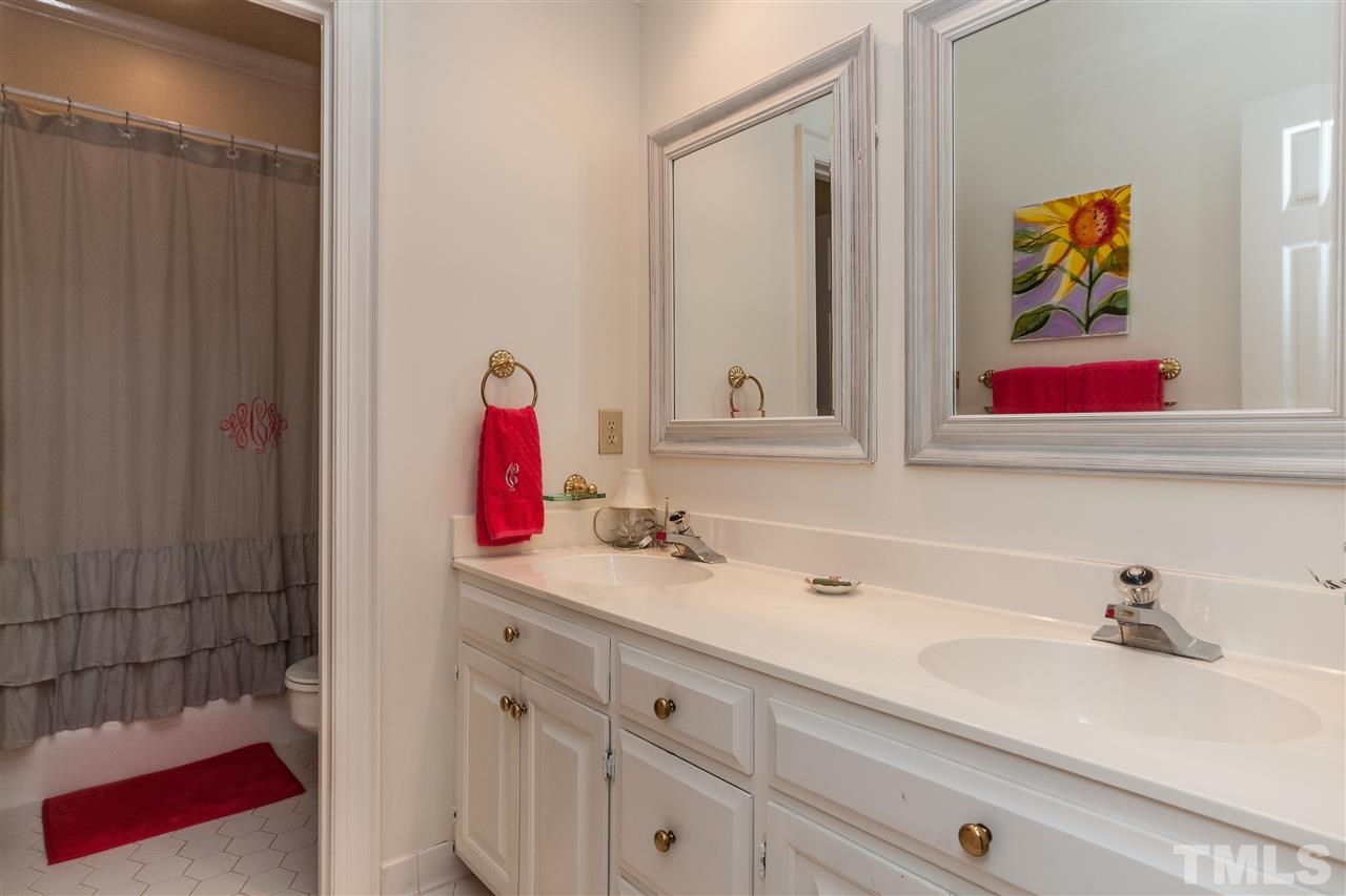 405 Lake Boone Trail Raleigh, NC 27608 - Photo 19 of 24 a bathroom with a sink and a mirror