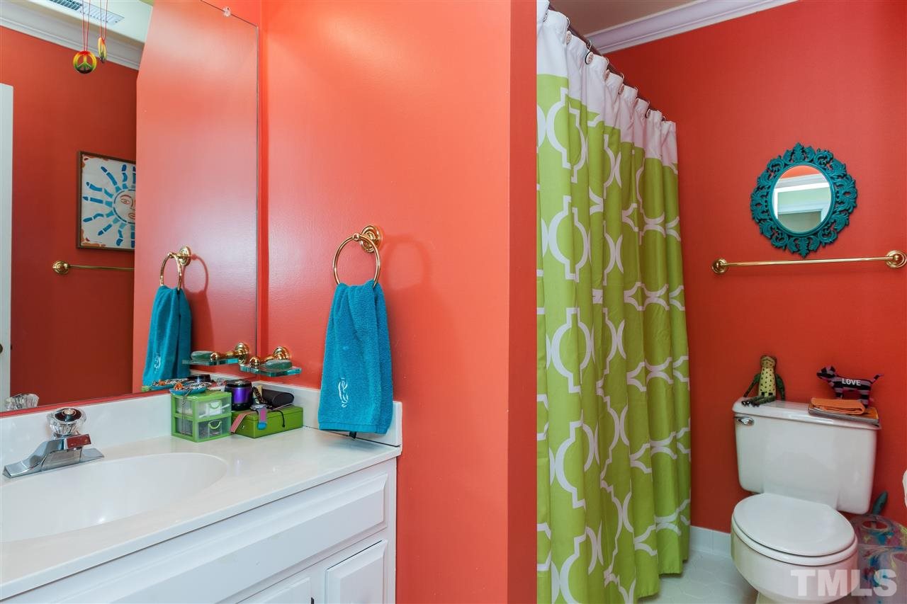 405 Lake Boone Trail Raleigh, NC 27608 - Photo 20 of 24 a bathroom with a toilet sink and mirror