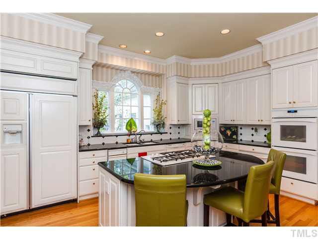 405 Lake Boone Trail Raleigh, NC 27608 - Photo 3 of 24 a kitchen with a sink cabinets and window