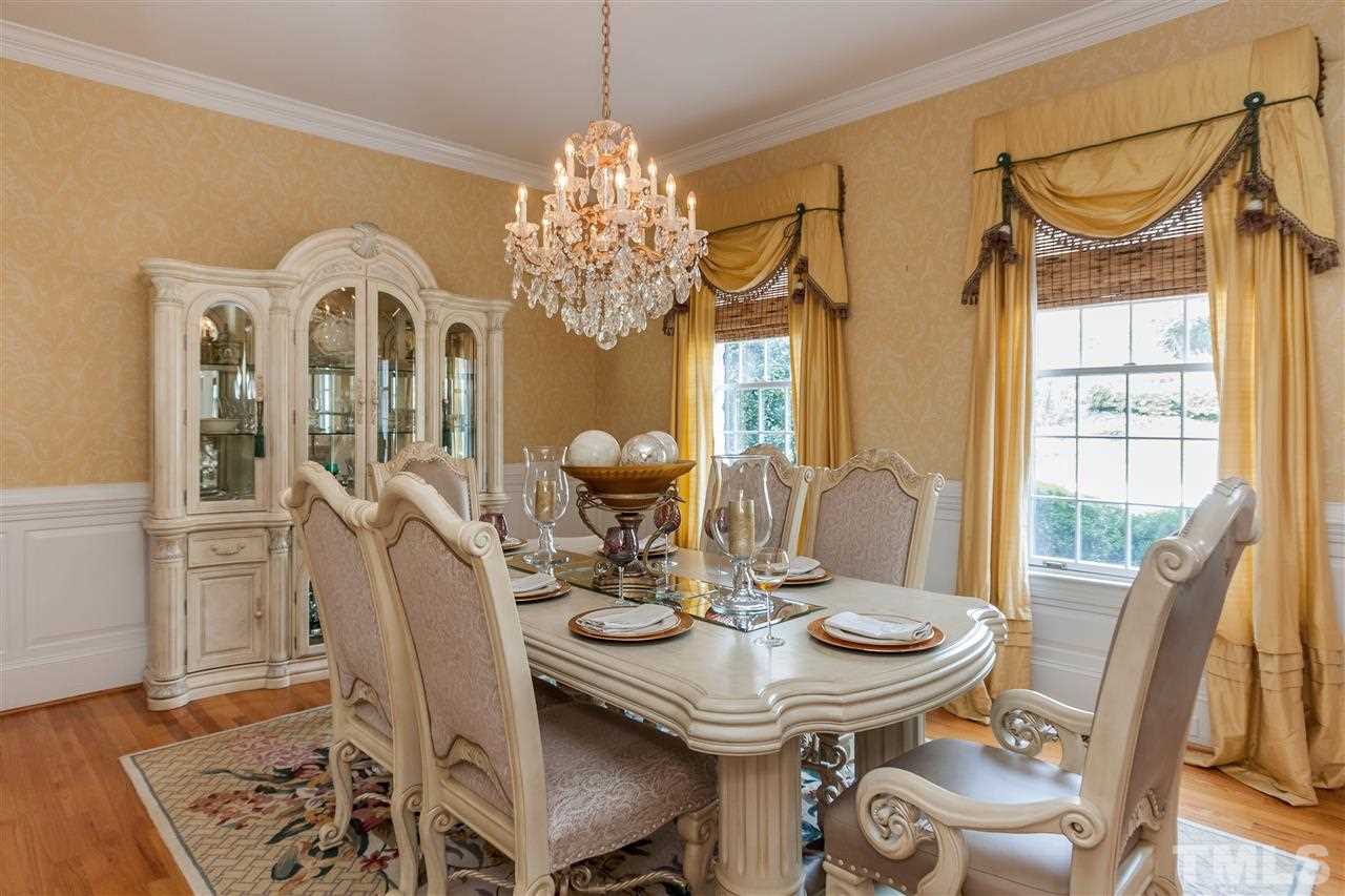 405 Lake Boone Trail Raleigh, NC 27608 - Photo 6 of 24 a view of a dining room with furniture and chandelier