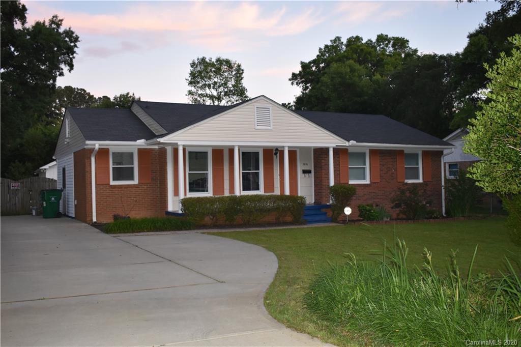 3816 Farmview Road Charlotte, NC 28205 - Photo 1 of 11 a front view of a house with a garden