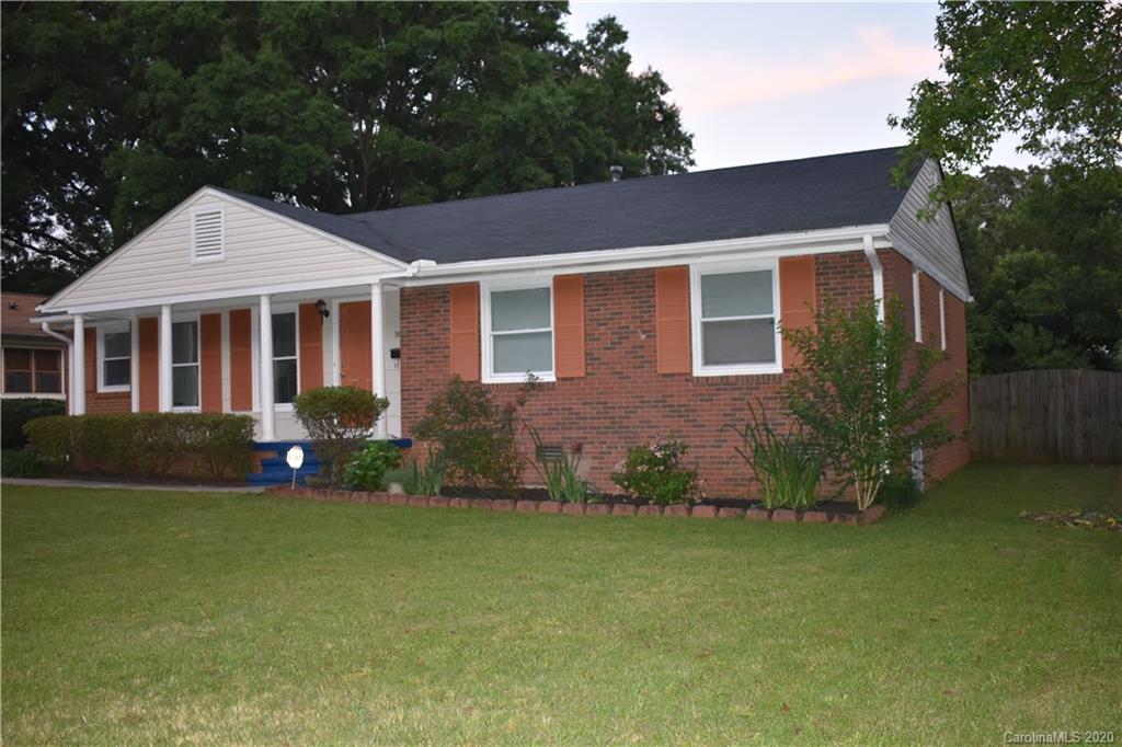 3816 Farmview Road Charlotte, NC 28205 - Photo 2 of 11 a front view of a house with a garden and yard