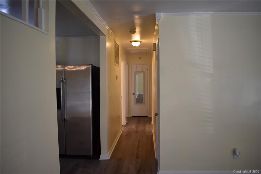 3816 Farmview Road Charlotte, NC 28205 - Photo 4 of 11 a view of a hallway with wooden floor